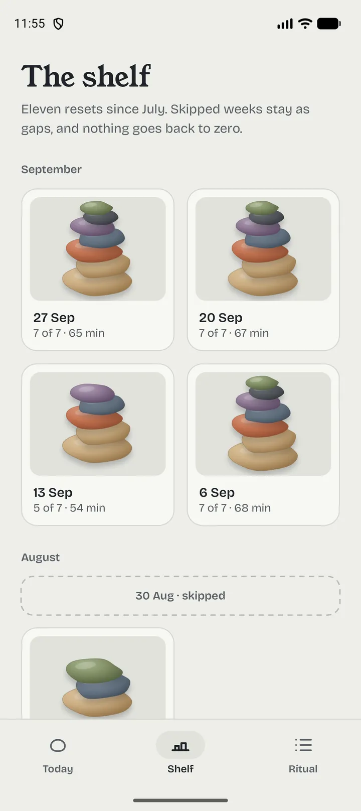 Hafta app screen: the shelf of finished weekly resets, one small cairn per week